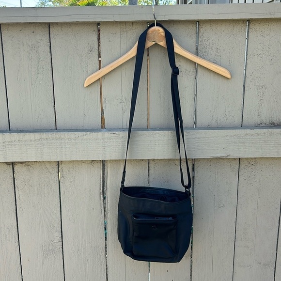 Lululemon Handbags - Lululemon Cross Body Small Drawstring Bucket Bag Has a Cosmetic Flaw See Photos